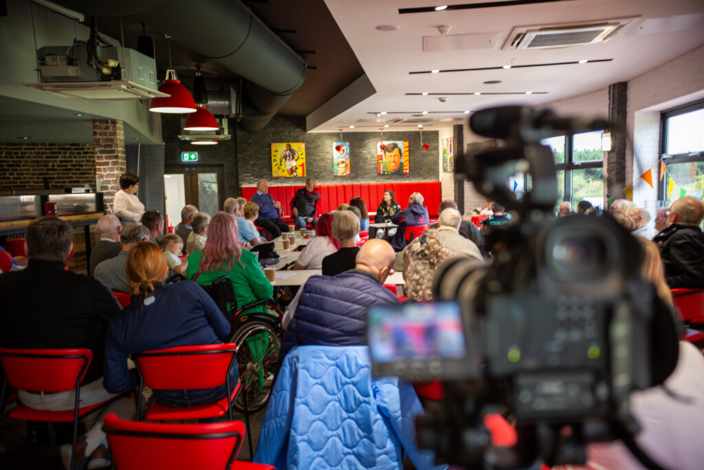 Photo shows camera filming packed Stoke Memories session at Ricardo's bar at Stoke City FC